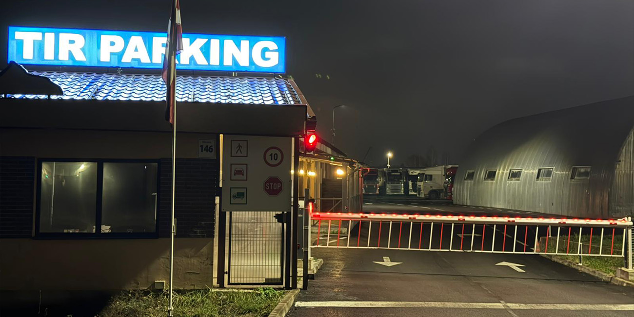 TIR parking entrance gates at night